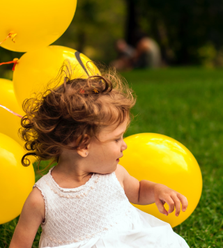little kid with yellow balloon photo